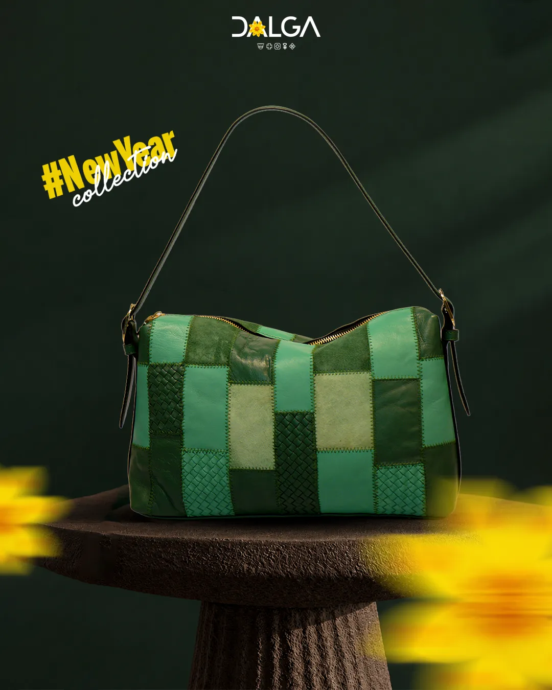 Green patchwork leather shoulder bag on a stone pedestal