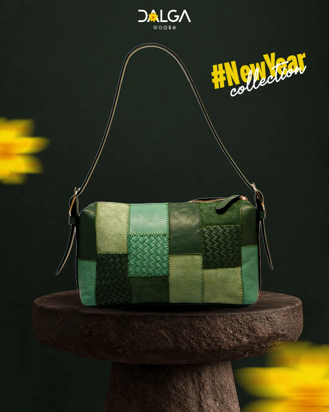 Green patchwork leather crossbody bag on a stone pedestal